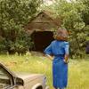 Forest Home ca 1988
Alice Lee Wadsworth, Becca and Howard looking at old garage behind the home.