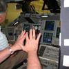 Frank Wadsworth getting instructions on how to land the space shuttle orbiter. 