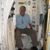 Frank seating on the space shuttle orbiter toliet.