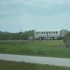 Shuttle Crew Transportation Vehicle headed to the crew quarters with the STS-131 crew on board.