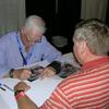 Gene Cernan Apollo 17 Commander. Last Man on the Moon. Pictured signing Jeff Hoff's speciel photo of himself pictured with the  Apollo 17 command module at the Navy Base in San Diego, CA.