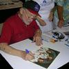 Buzz Aldren the Apollo 11 Lunar Module Pilot. First crew to land on the Moon in 1969. Buzz signing a crew photo. 