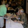 Frank showing Alan Bean, Apollo 12 LMP, a photo of Alan while on the Moon. Alan Bean talked about his experience walking on the Moon.